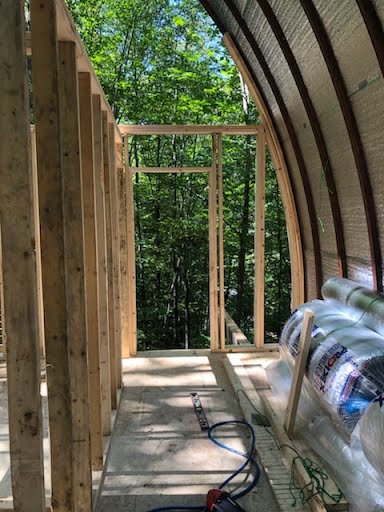 Interior — Quonset arc framing, insulation rolls, Beech Mountain NC