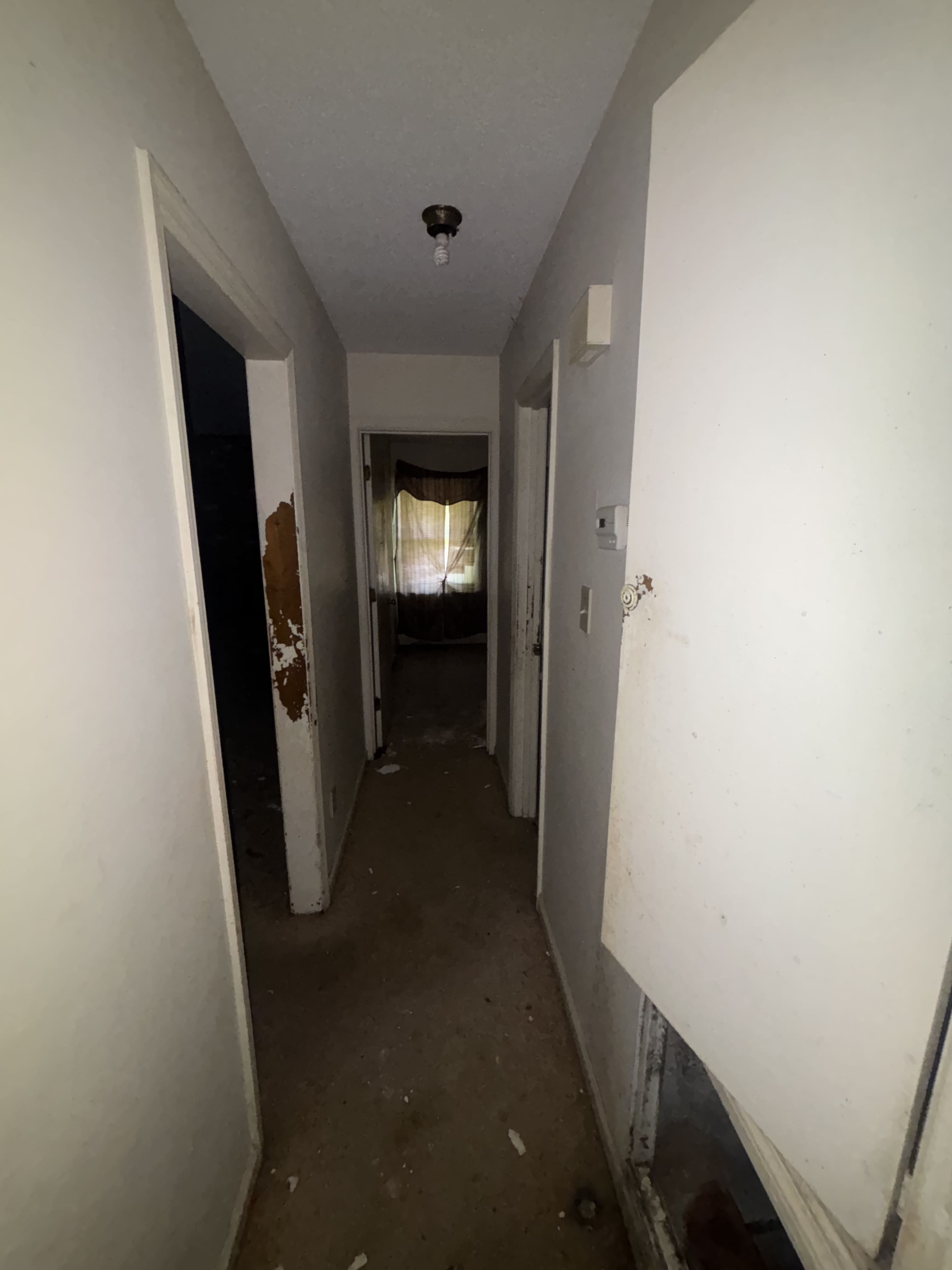 Hallway — peeling doorframes, wall damage, Fayetteville NC
