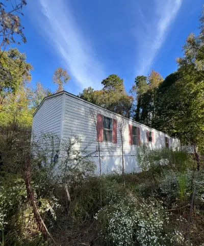 Before: Elderly Out-of-State Owner — Code Violations