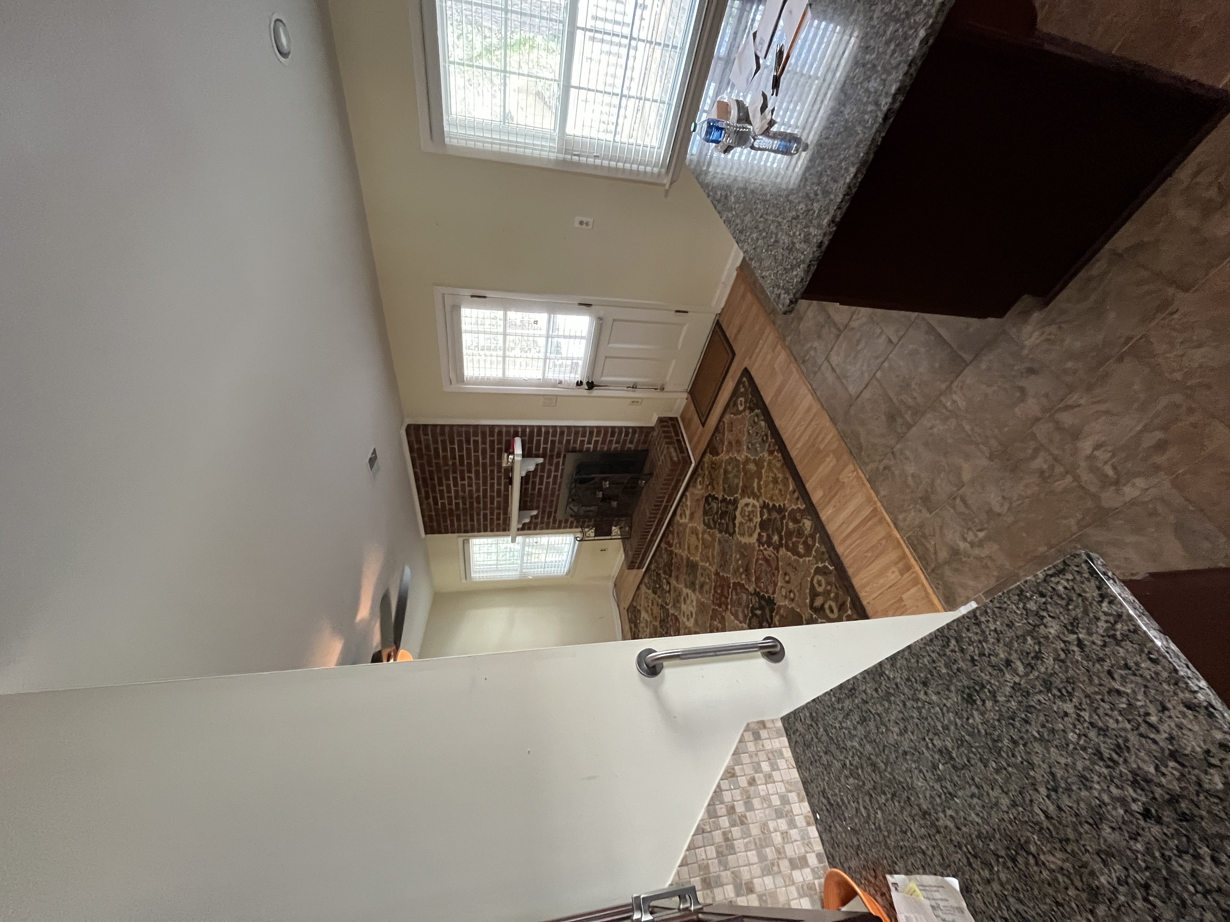 Living room — brick fireplace, hardwood floors, Matthews NC