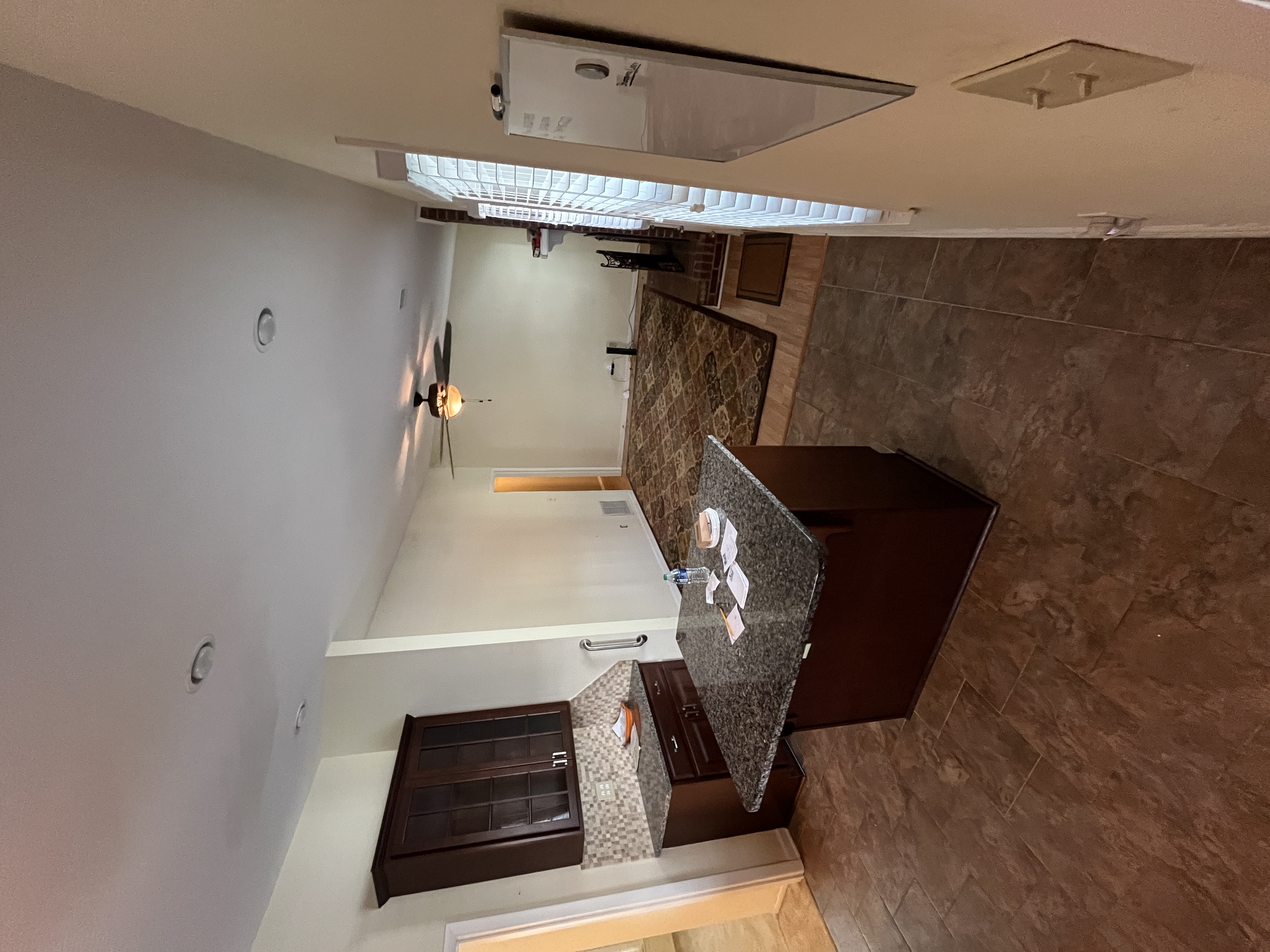 Open kitchen-to-living view — granite island, Matthews NC