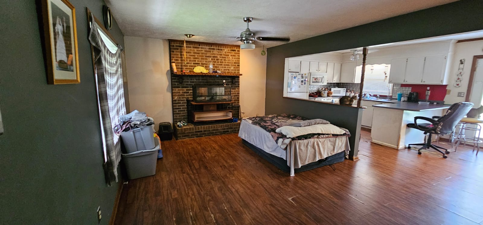 Living room — brick fireplace, open to kitchen, Rockingham NC