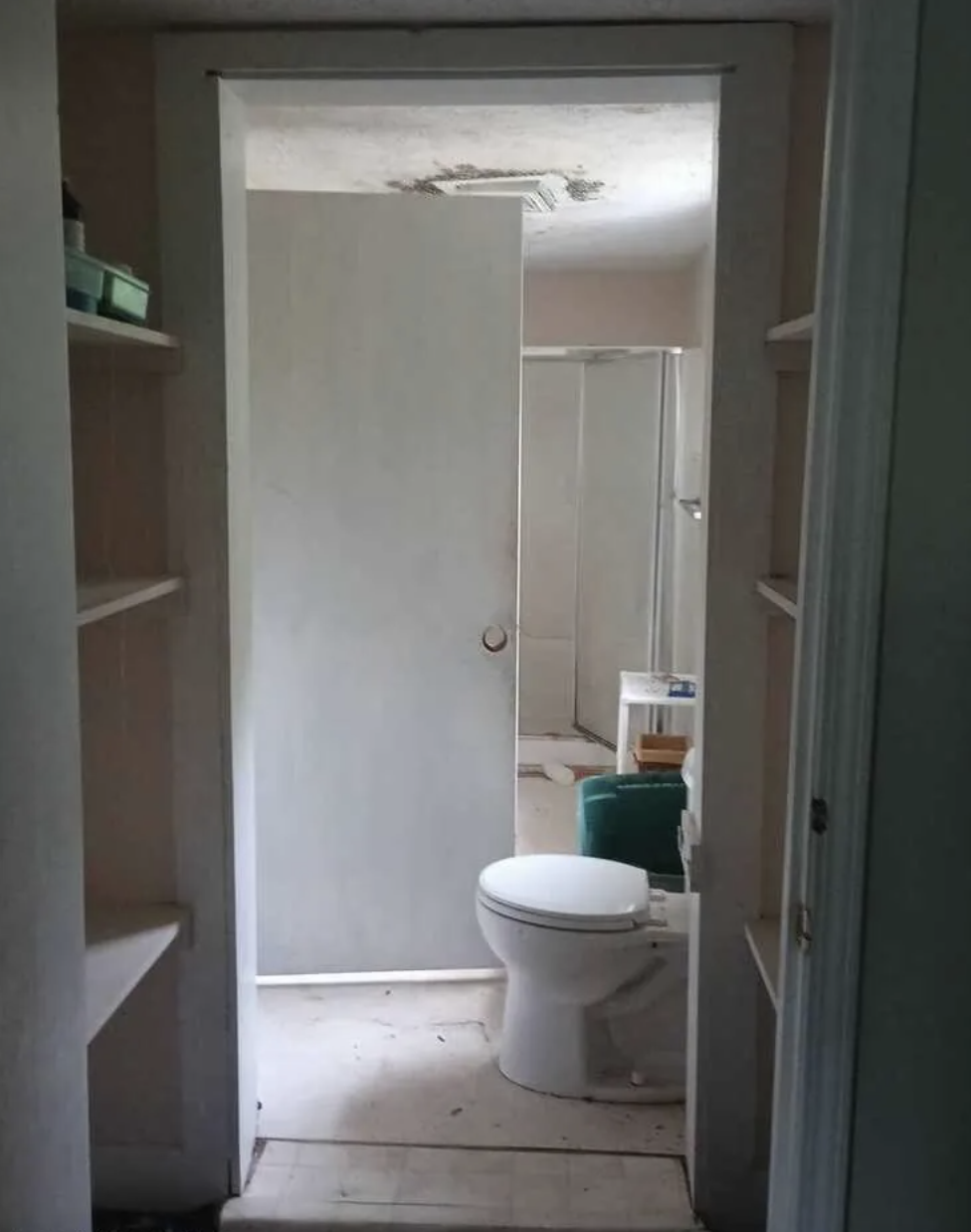 Interior bathroom — damaged ceiling, stripped floors, Rockingham NC