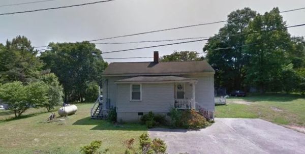 Exterior rear view — tenant damage visible, Rockingham NC