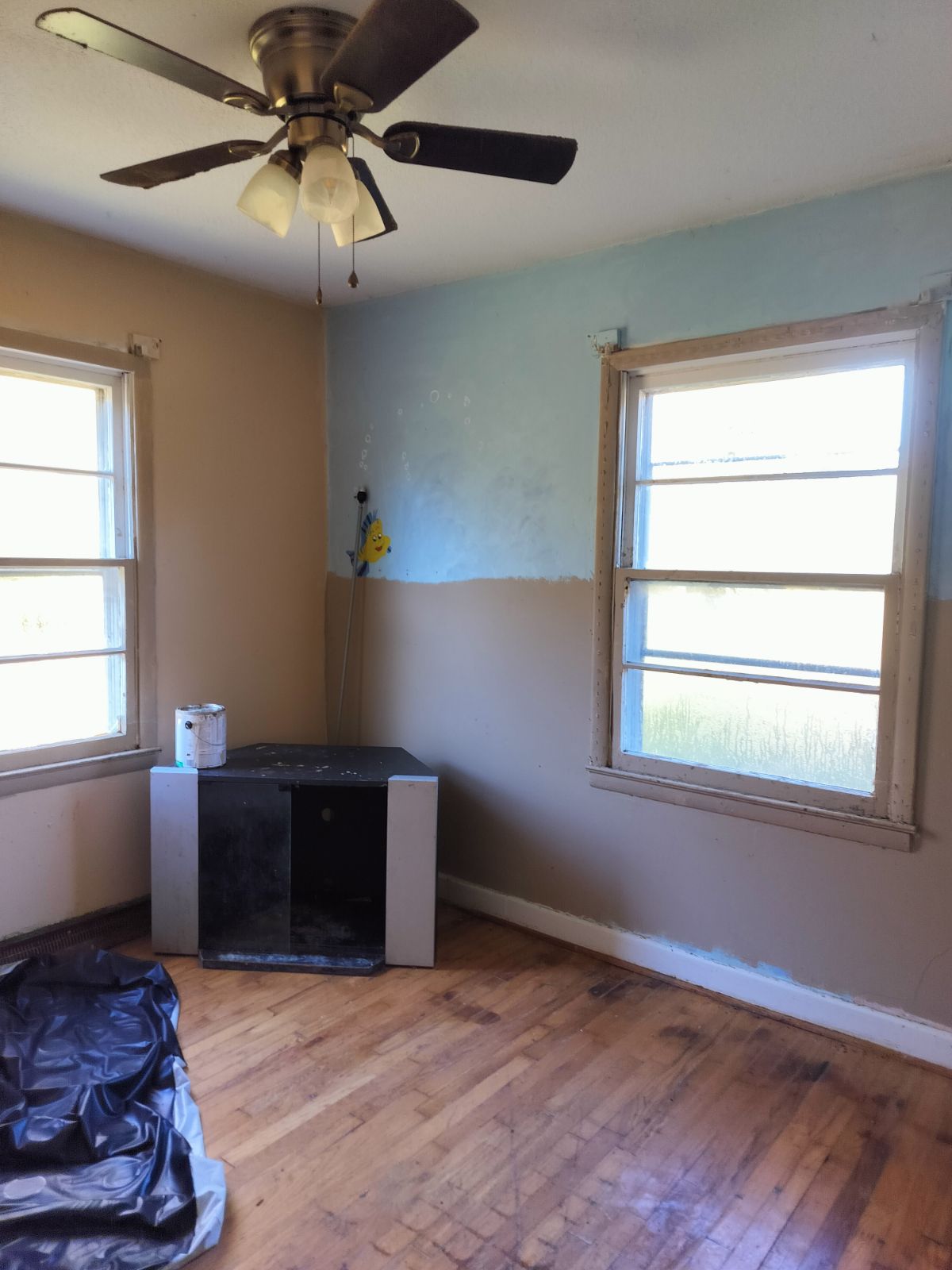 Second bedroom — half-painted walls with fish mural, Stoneville NC