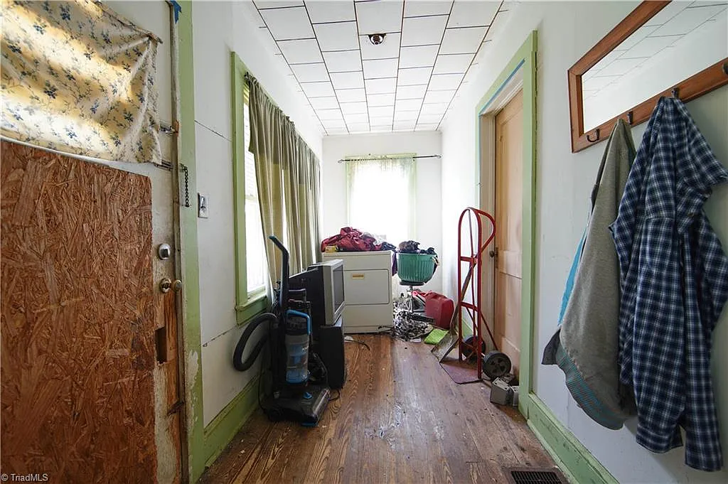 Hallway and laundry area — belongings throughout, Winston-Salem NC